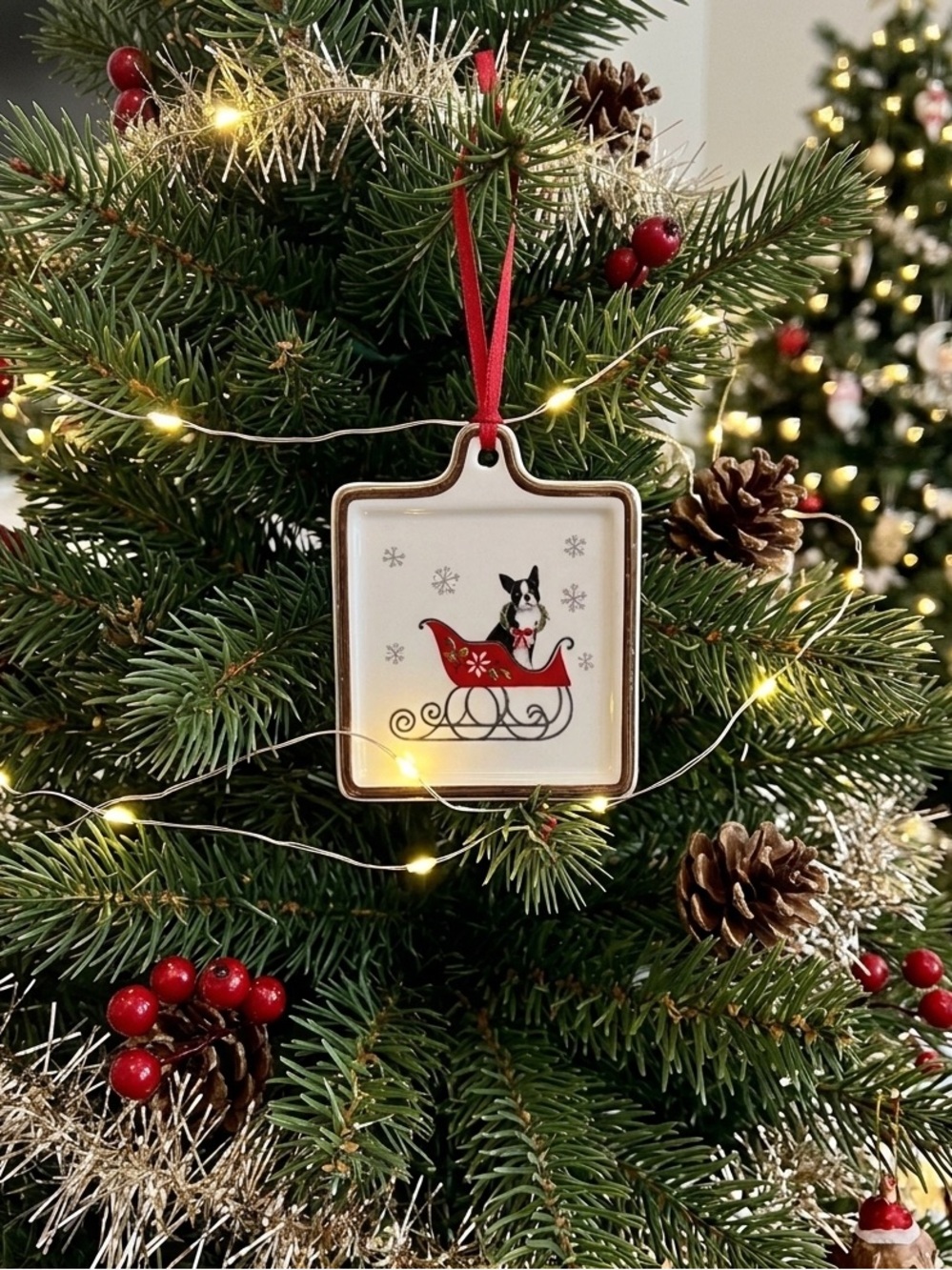 Fringe Christmas ornament featuring a Boston Terrier dog in a red sleigh